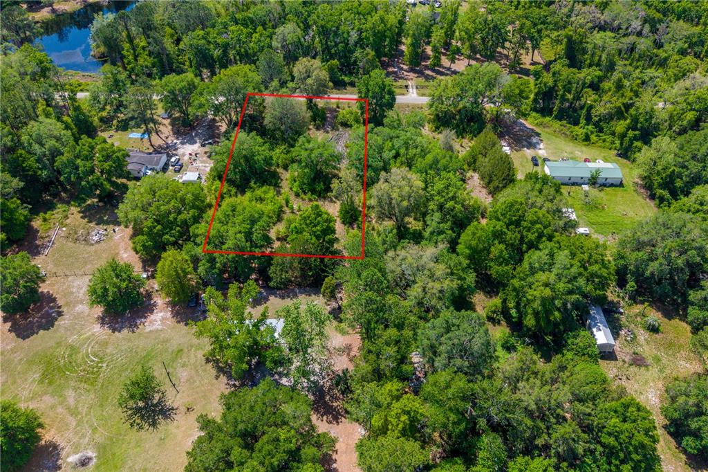 Tbd Southwest 52nd Terrace Lake Butler, FL 32054 - Photo 4 of 7 an aerial view of residential house with outdoor space and trees all around