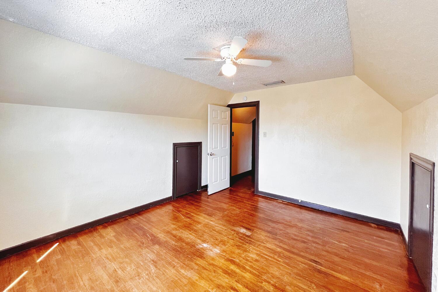 3002 21st Street Lubbock, TX 79410 - Photo 16 of 41 a view of an empty room with wooden floor