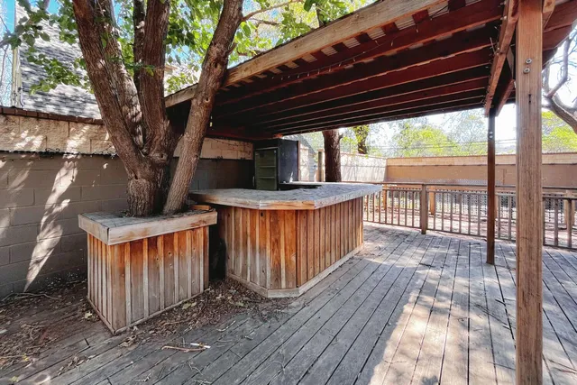 a view of a deck with wooden floor and outdoor space