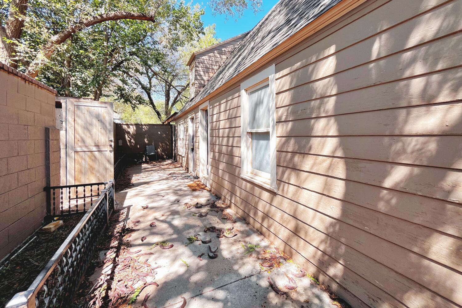 3002 21st Street Lubbock, TX 79410 - Photo 30 of 41 a view of a yard with wooden fence