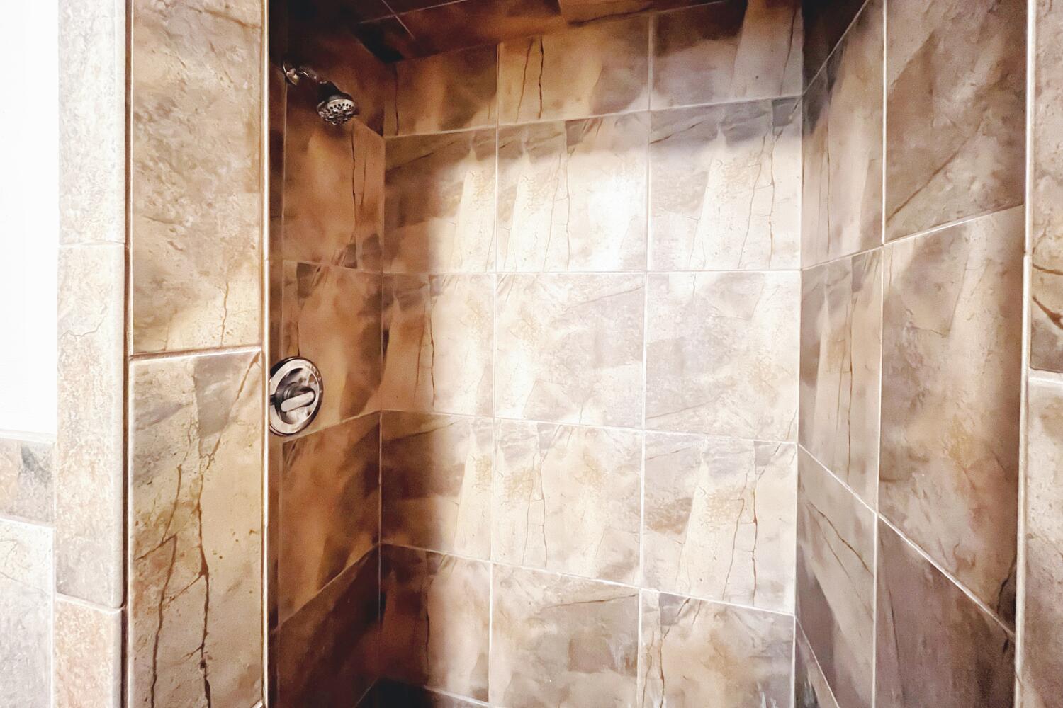 3002 21st Street Lubbock, TX 79410 - Photo 36 of 41 a bathroom with a shower