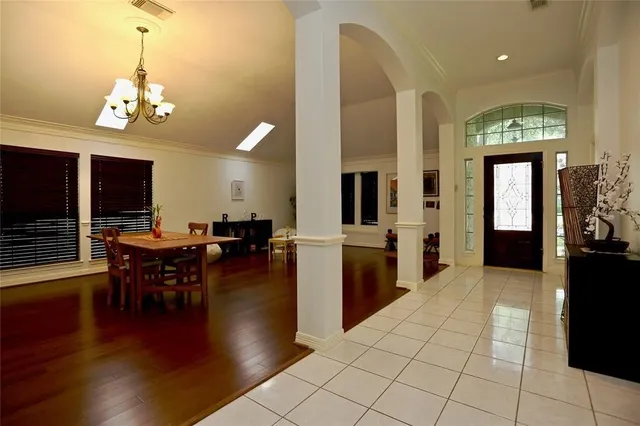 a lobby with furniture and wooden floor