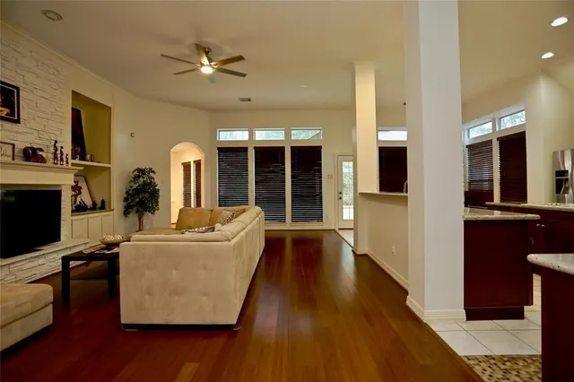 a living room with furniture and a fireplace