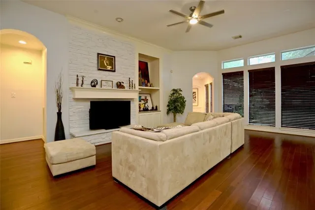 a living room with furniture and a fireplace
