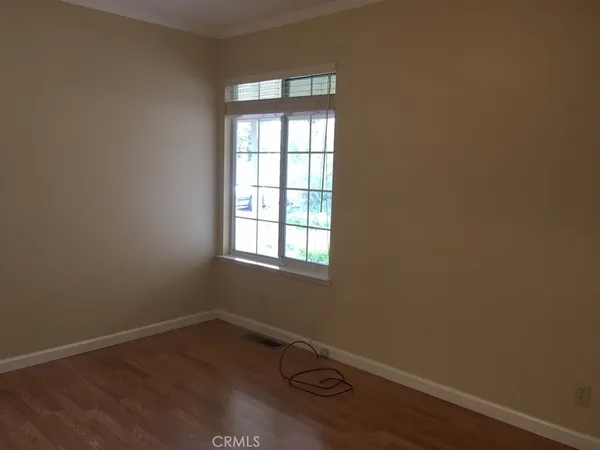 a view of balcony with wooden floor