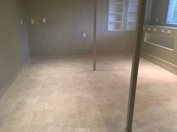 an aerial view of residential house with outdoor space and trees all around