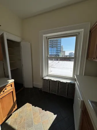 a view of an empty room and a window