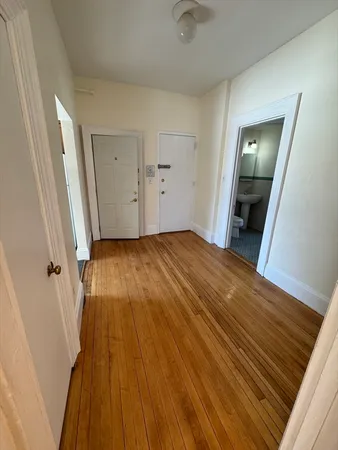 wooden floor in a hall with an entryway