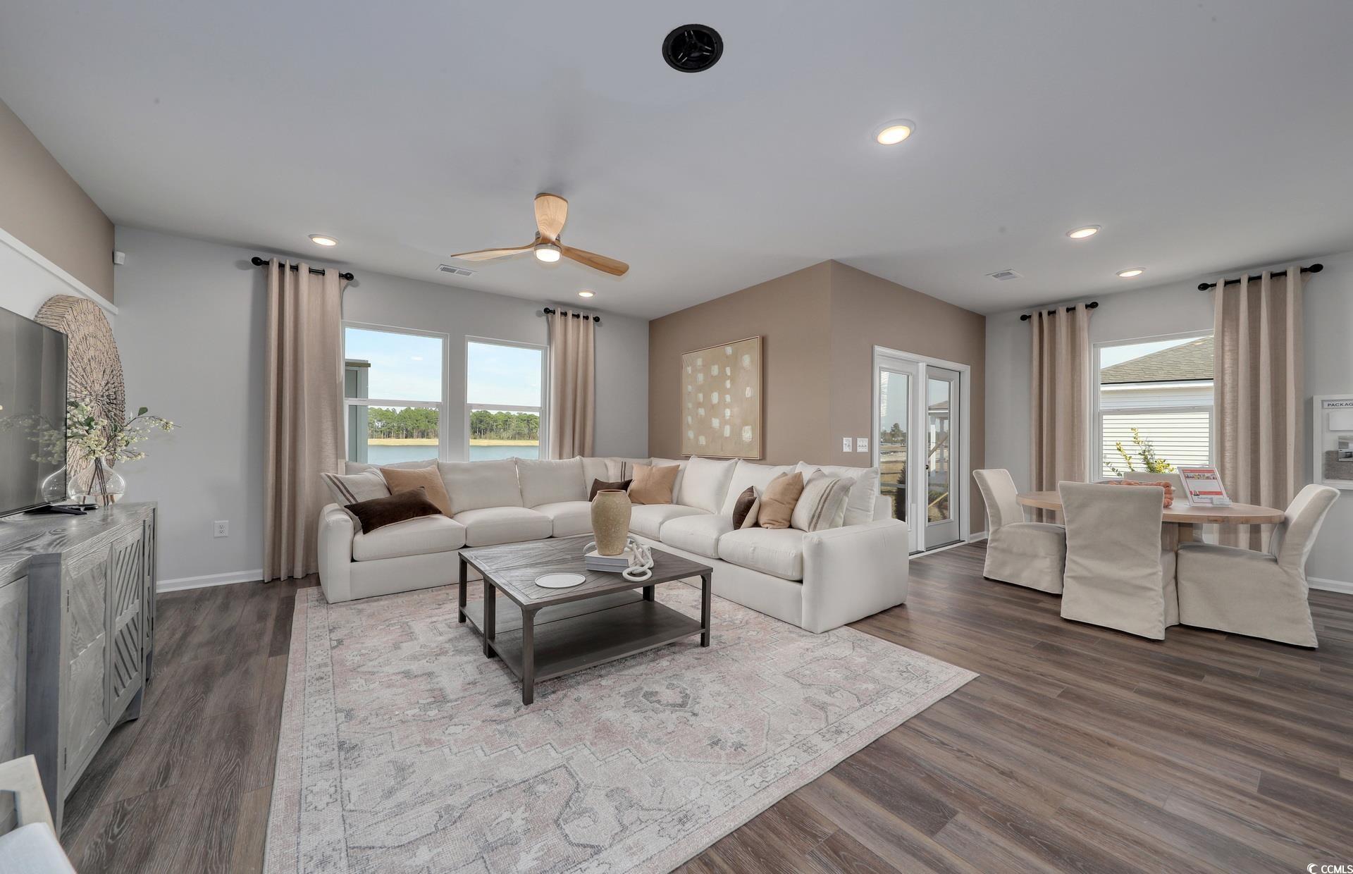 3102 Visionary Drive Myrtle Beach, SC 29588 - Photo 12 of 19 Living room featuring ceiling fan, dark wood finished floors, recessed lighting, and a water view