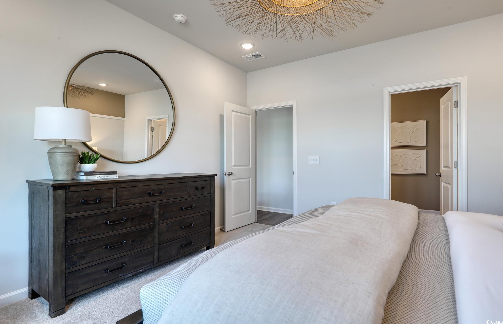 3102 Visionary Drive Myrtle Beach, SC 29588 - Photo 13 of 19 Bedroom with light carpet, recessed lighting, and ensuite bath