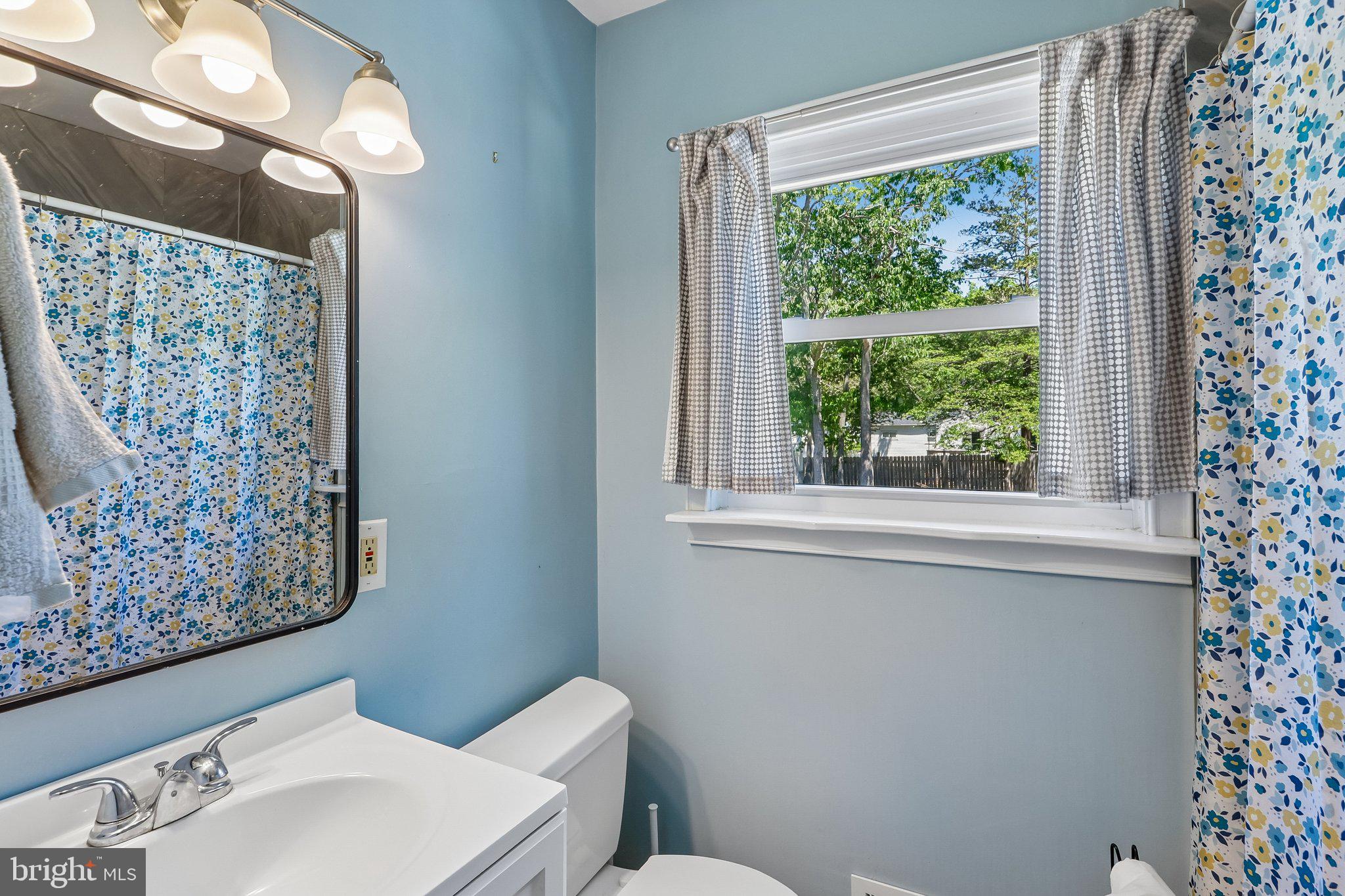 73 Burnt Tavern Road Brick, NJ 08724 - Photo 20 of 31 a bathroom with a toilet sink and window