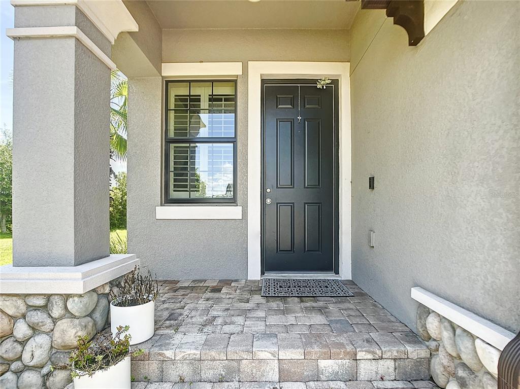4744 Wandering Way Wesley Chapel, FL 33544 - Photo 2 of 39 a view of front door