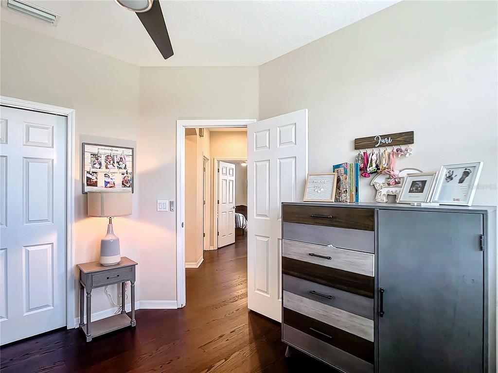 4744 Wandering Way Wesley Chapel, FL 33544 - Photo 24 of 39 a view of room with furniture and wooden floor