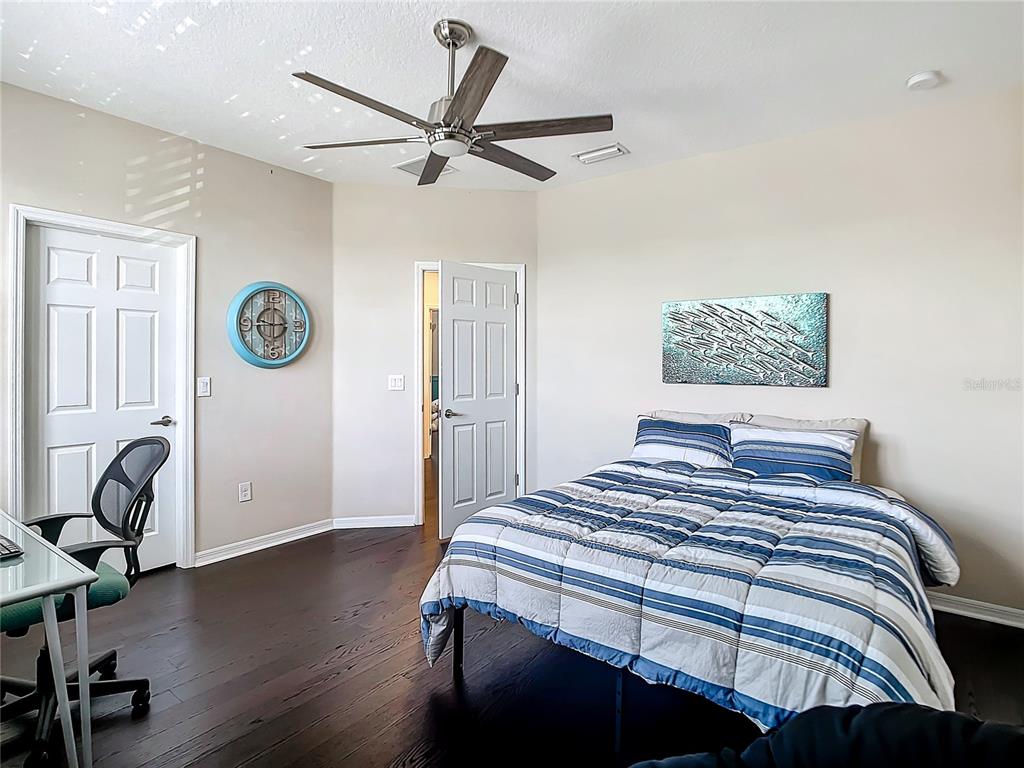 4744 Wandering Way Wesley Chapel, FL 33544 - Photo 25 of 39 a bedroom with a bed and a window