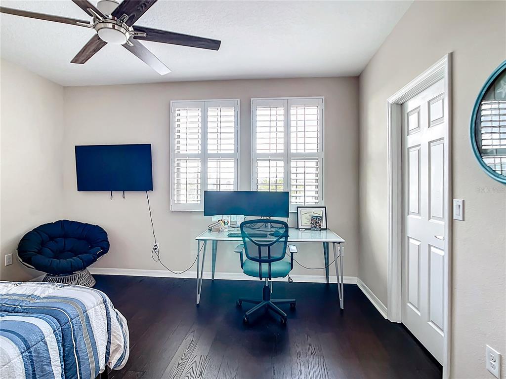 4744 Wandering Way Wesley Chapel, FL 33544 - Photo 26 of 39 a view of a livingroom with workspace and a window
