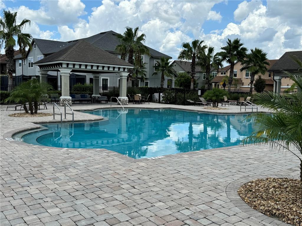 4744 Wandering Way Wesley Chapel, FL 33544 - Photo 34 of 39 a view of a swimming pool with a patio
