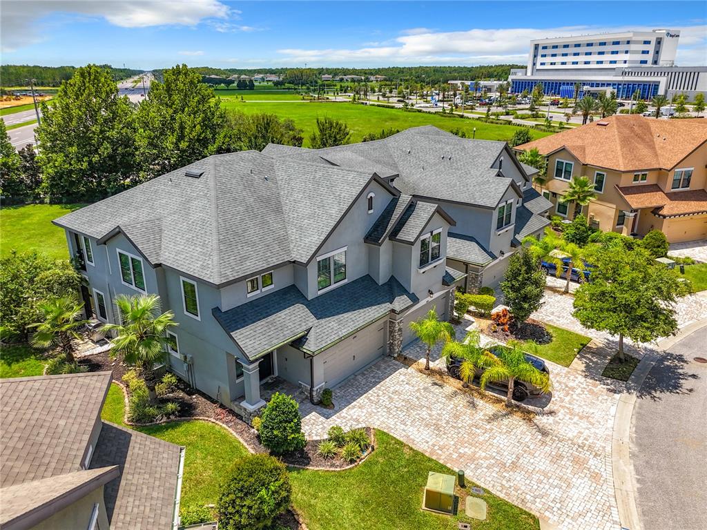 4744 Wandering Way Wesley Chapel, FL 33544 - Photo 36 of 39 an aerial view of a house with a garden