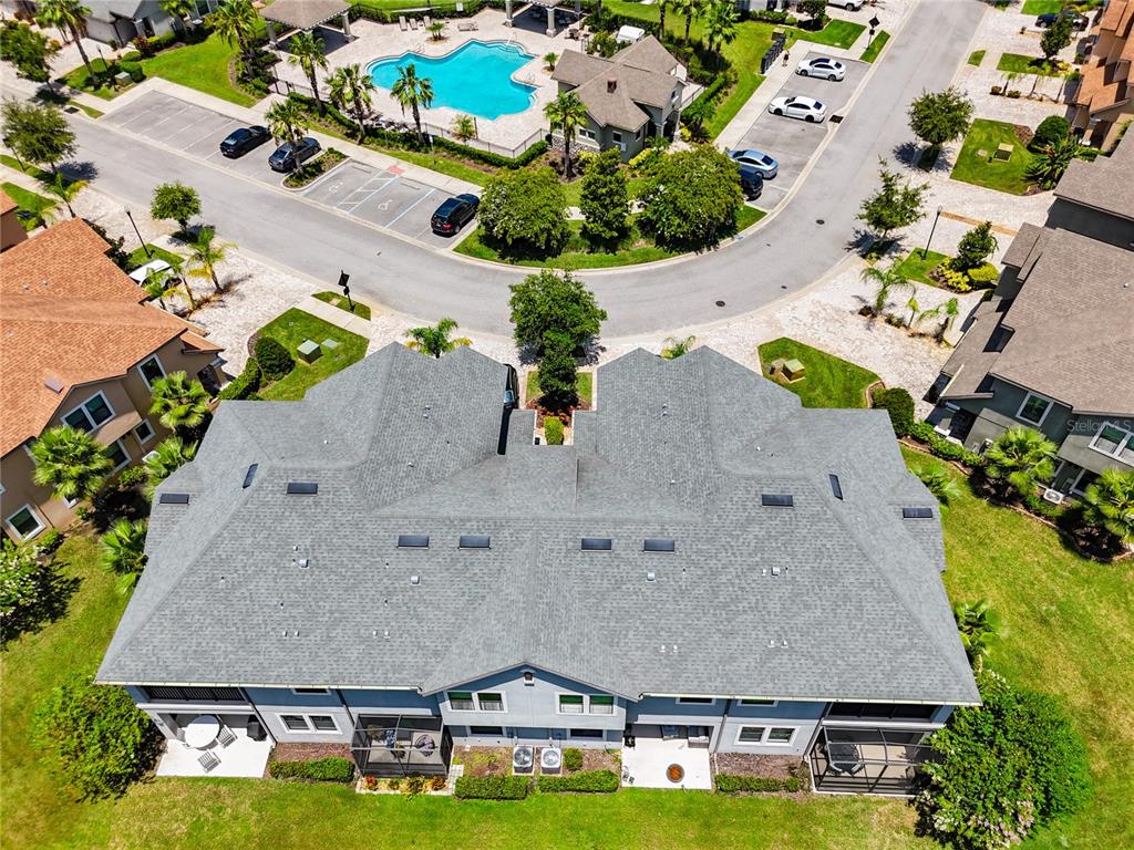 4744 Wandering Way Wesley Chapel, FL 33544 - Photo 38 of 39 an aerial view of a house with a swimming pool and outdoor seating