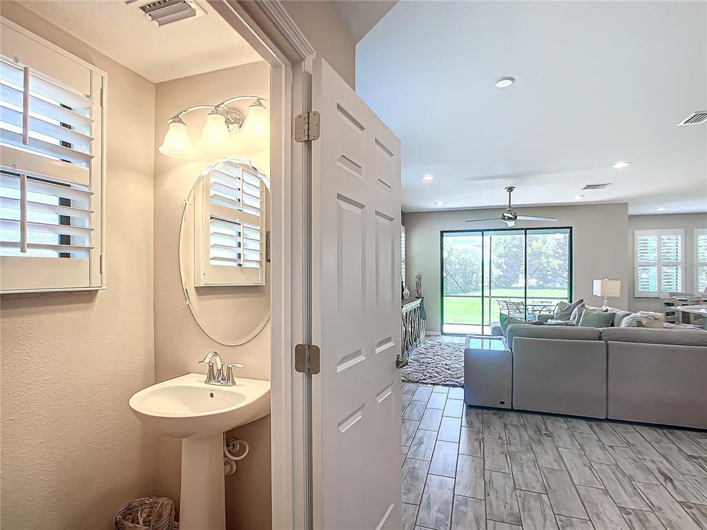 4744 Wandering Way Wesley Chapel, FL 33544 - Photo 5 of 39 a spacious bathroom with a sink and a mirror