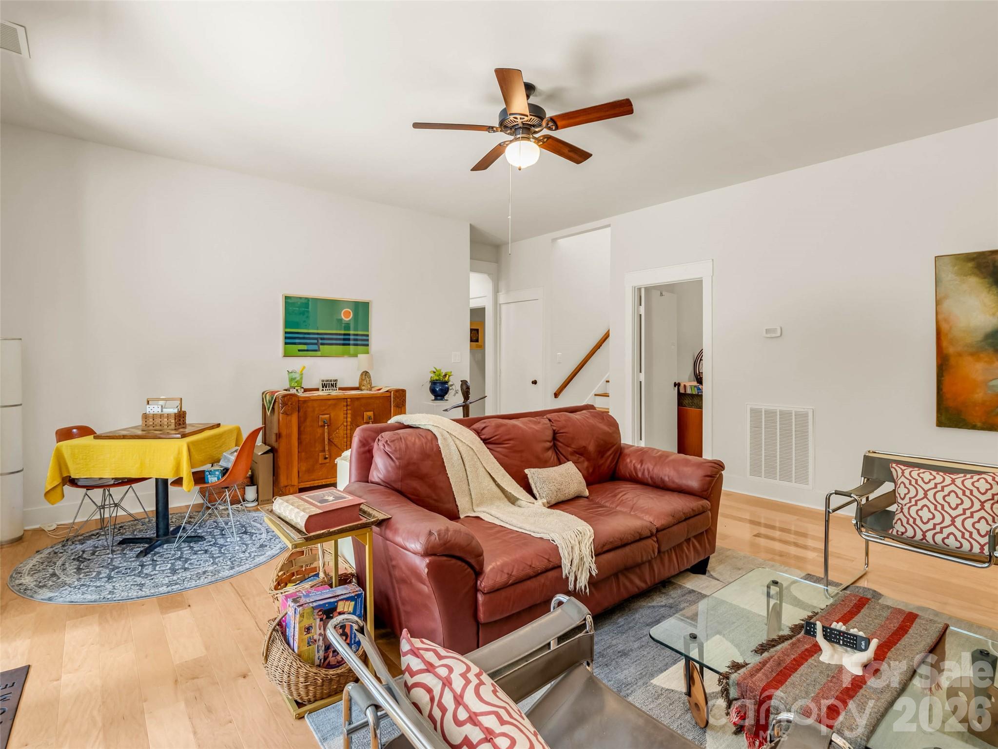 120 Glenn Court Mill Spring, NC 28756 - Photo 30 of 48 a living room with furniture a rug and a chandelier