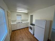 3014 22nd Street Lubbock, TX 79410 - Photo 20 of 23 a kitchen with a sink stove and refrigerator