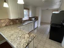 3014 22nd Street Lubbock, TX 79410 - Photo 2 of 23 a kitchen with a sink and cabinets