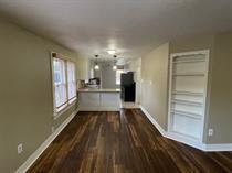 3014 22nd Street Lubbock, TX 79410 - Photo 8 of 23 a view of a hallway with wooden floor and a kitchen