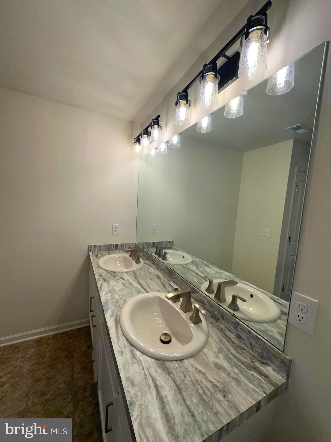 78 Tansboro Road Berlin, NJ 08009 - Photo 19 of 24 a bathroom with a sink and a mirror