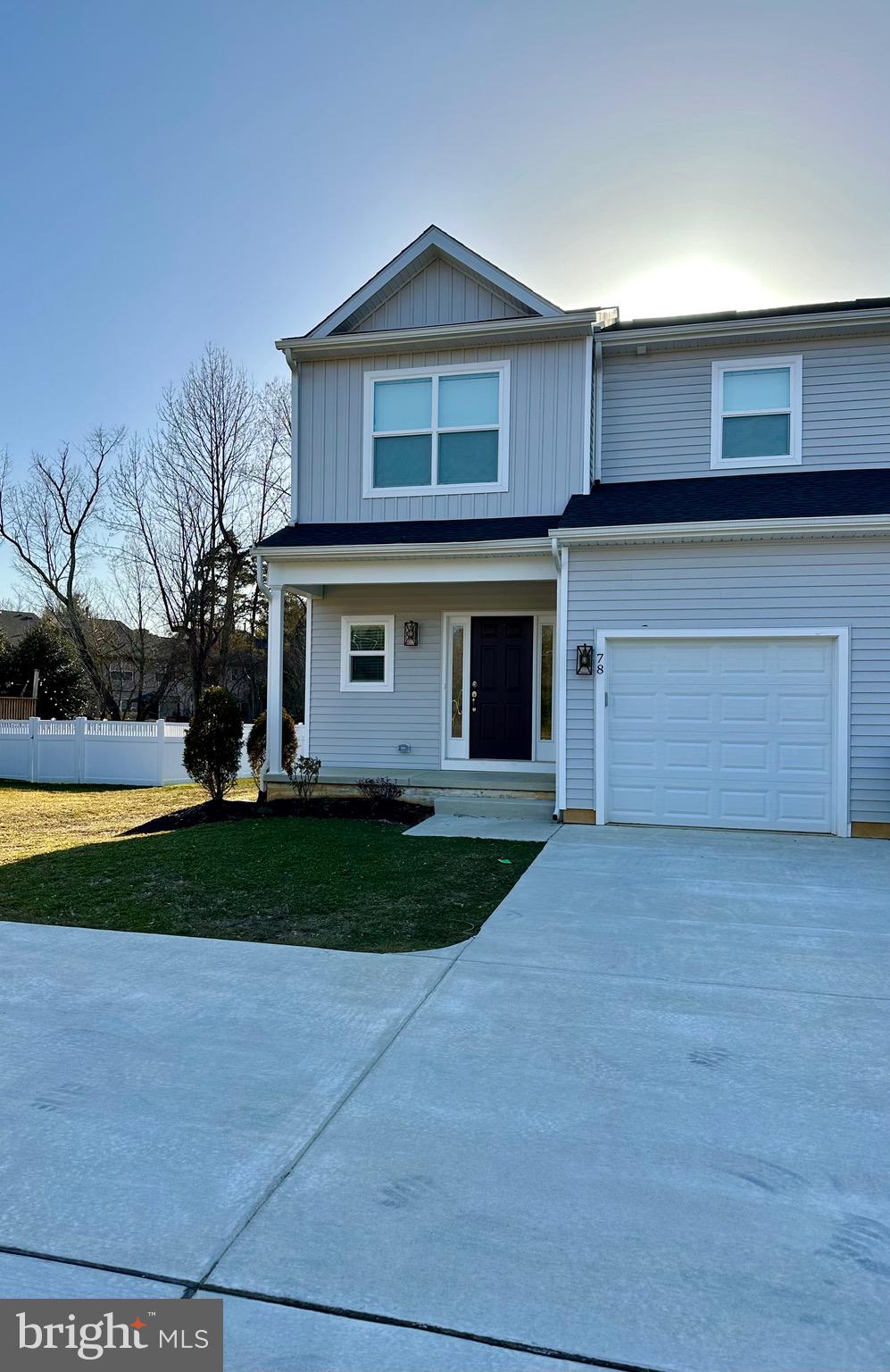 78 Tansboro Road Berlin, NJ 08009 - Photo 23 of 24 a front view of a house with a yard and garage