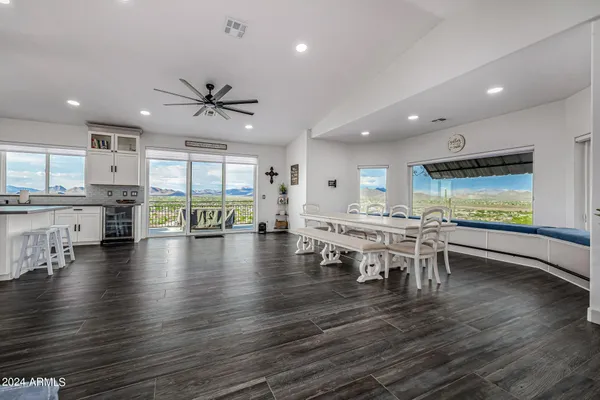 a kitchen with stainless steel appliances a refrigerator and a stove top oven