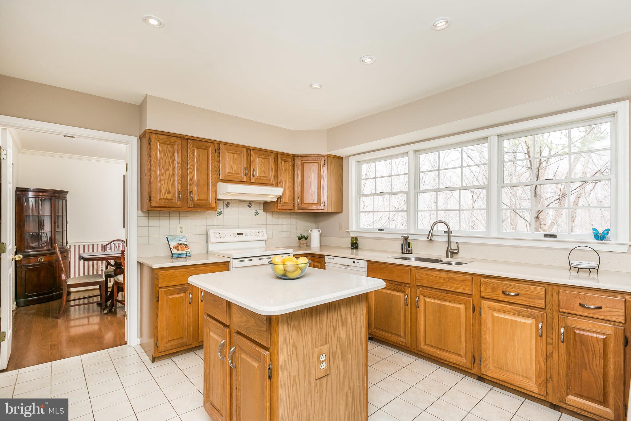 9307 Bellbeck Road Baltimore, MD 21234 - Photo 14 of 58 Quartz counters with island
