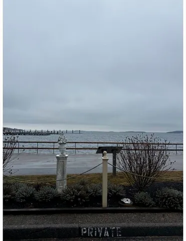 a view of a balcony with wooden floor and city view
