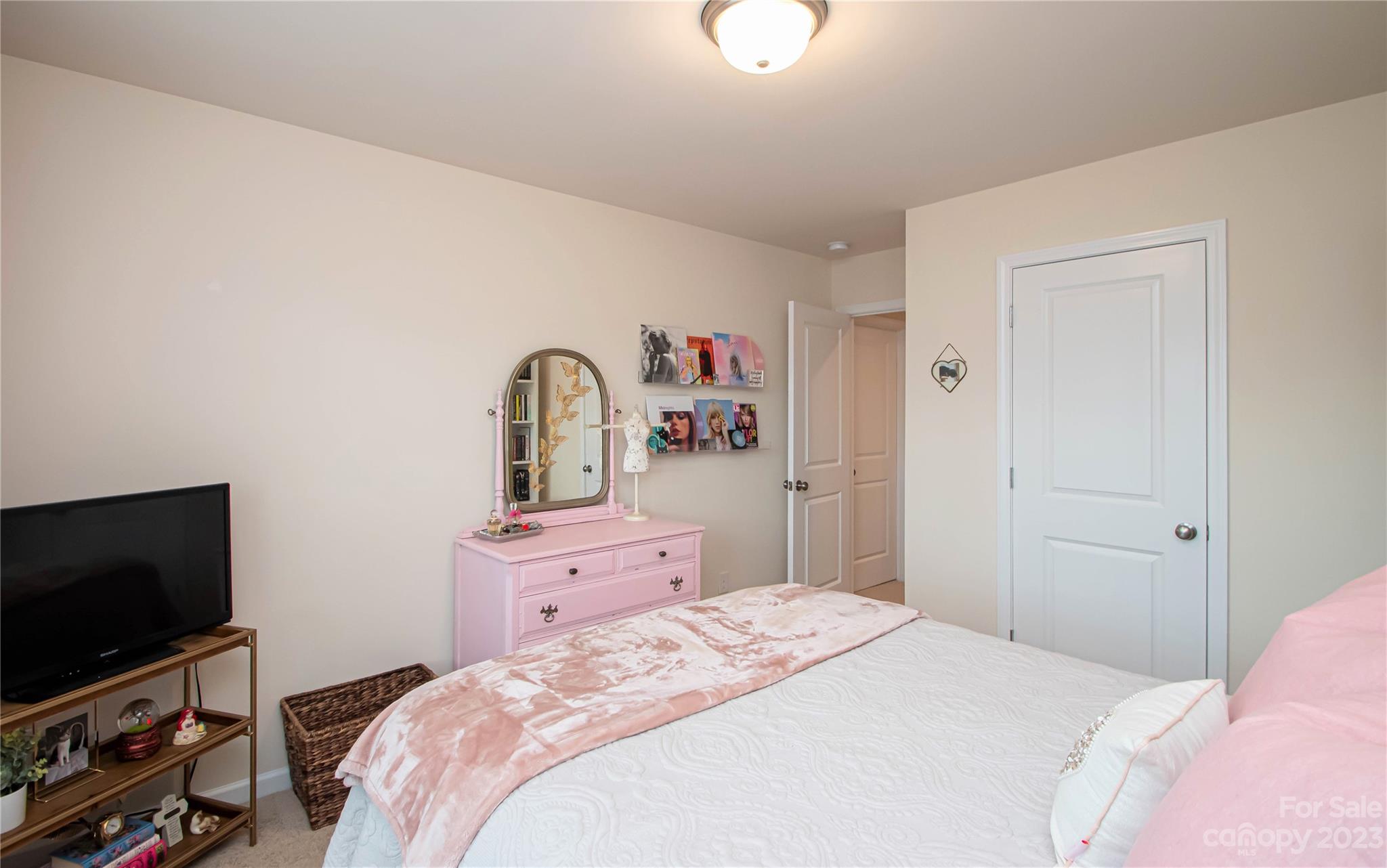 489 Hunters Dance Road Fort Mill, SC 29708 - Photo 14 of 36 a bedroom with a bed and a flat screen tv