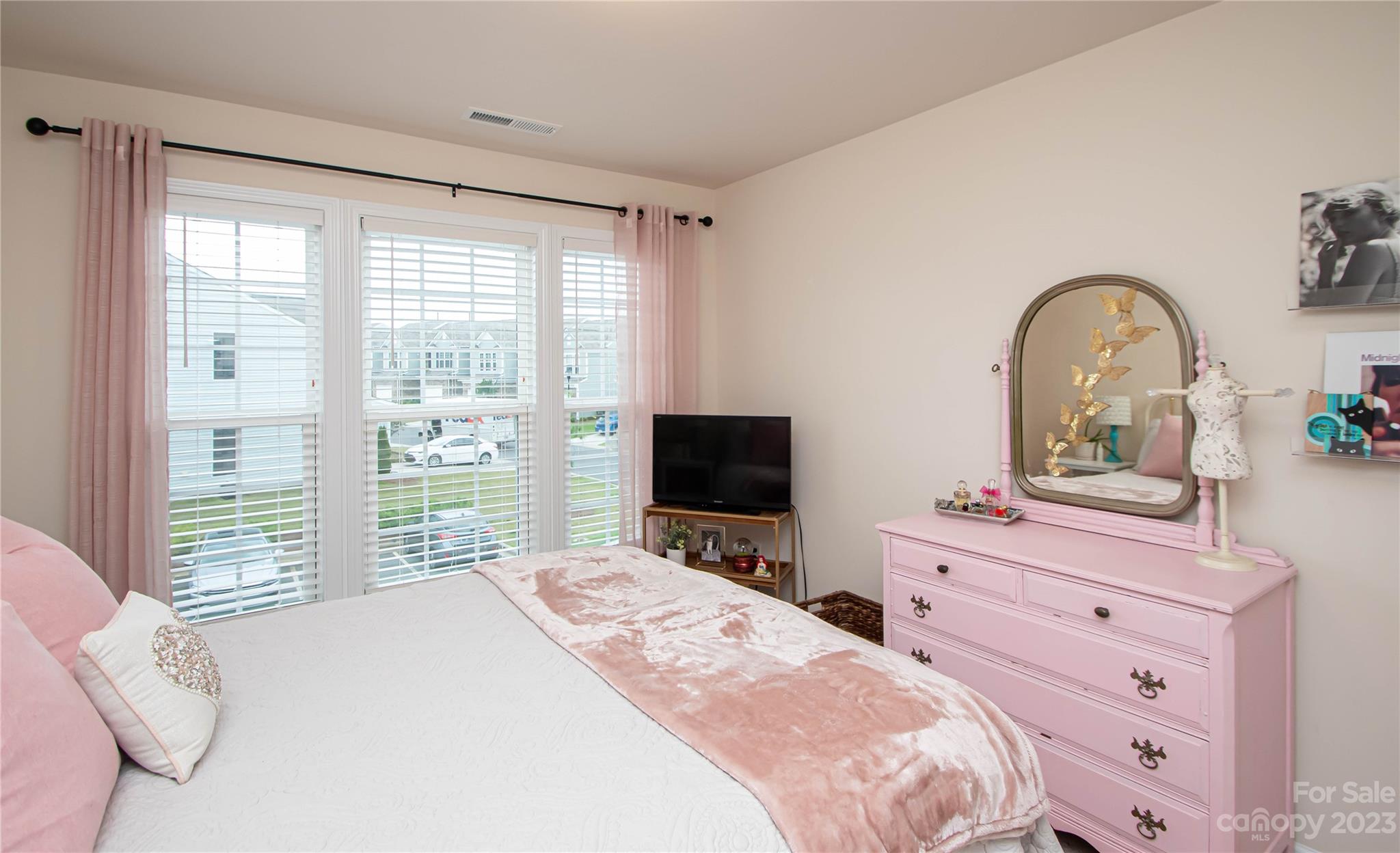 489 Hunters Dance Road Fort Mill, SC 29708 - Photo 15 of 36 a bedroom with a bed and large windows