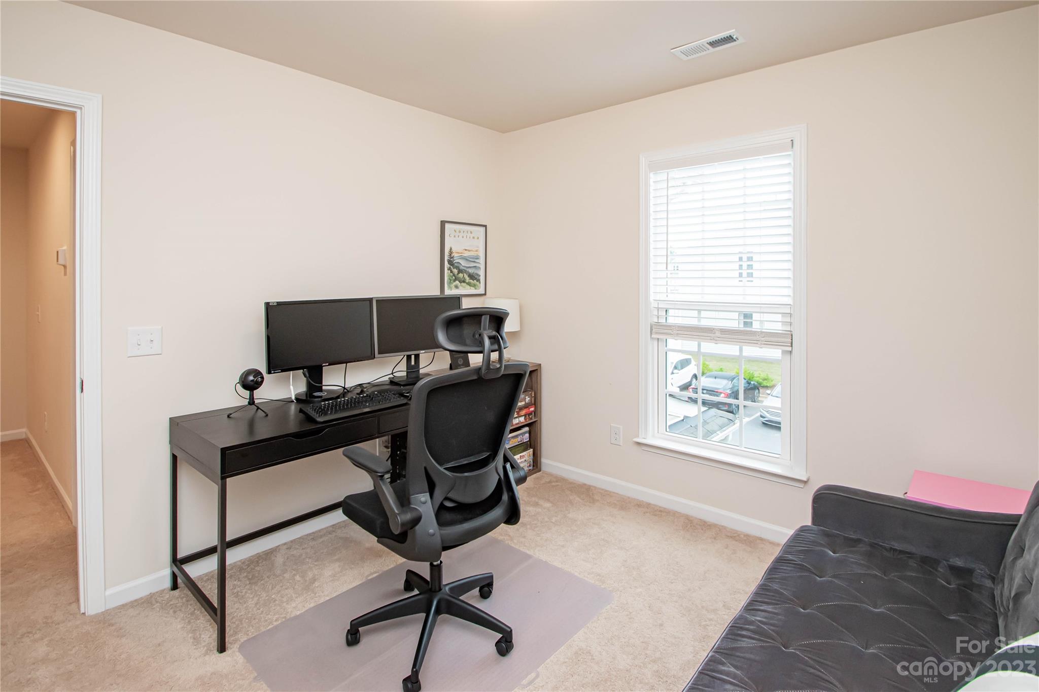 489 Hunters Dance Road Fort Mill, SC 29708 - Photo 18 of 36 a view of a workspace with furniture and a window