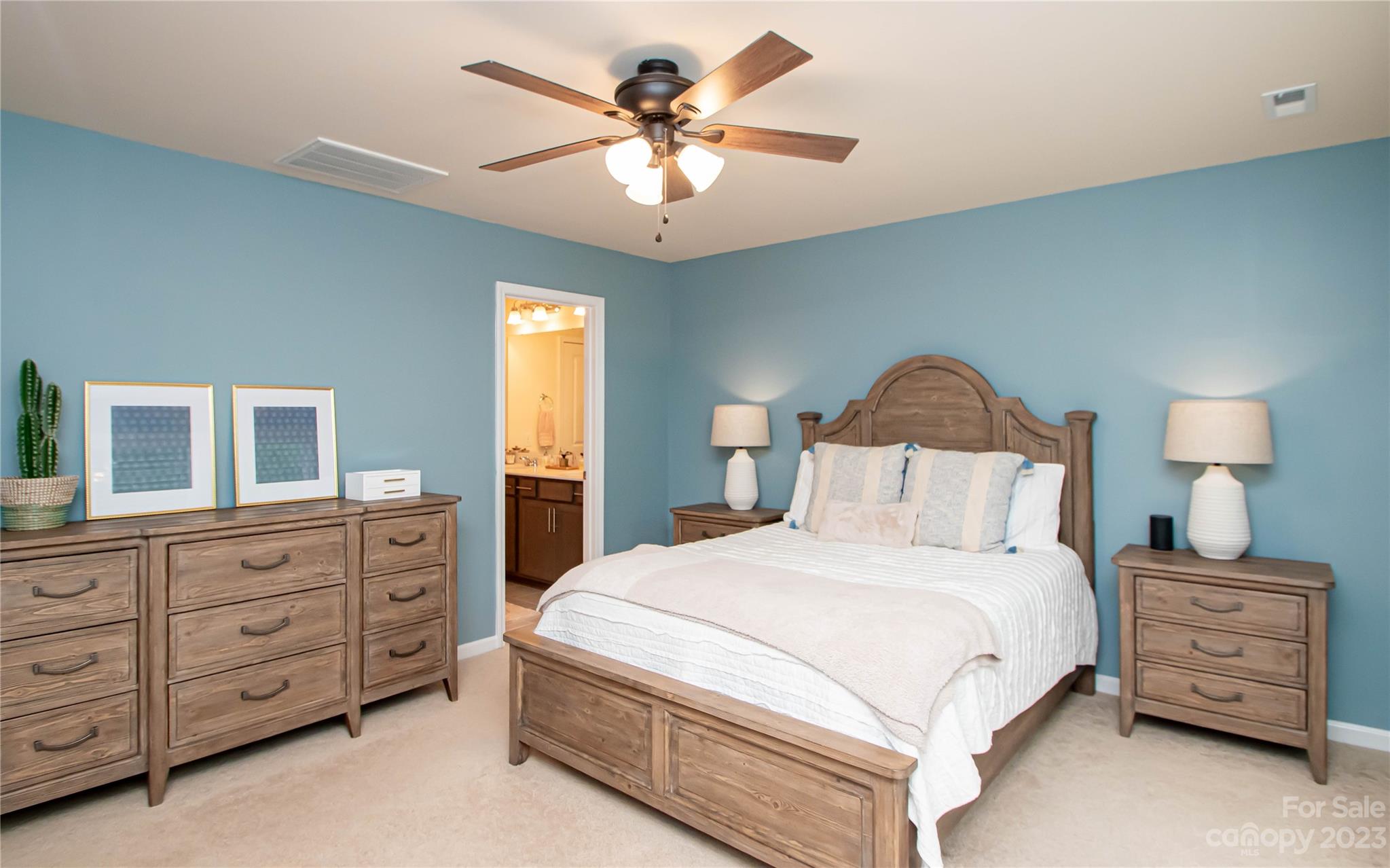 489 Hunters Dance Road Fort Mill, SC 29708 - Photo 21 of 36 a bedroom with a large bed and a dresser