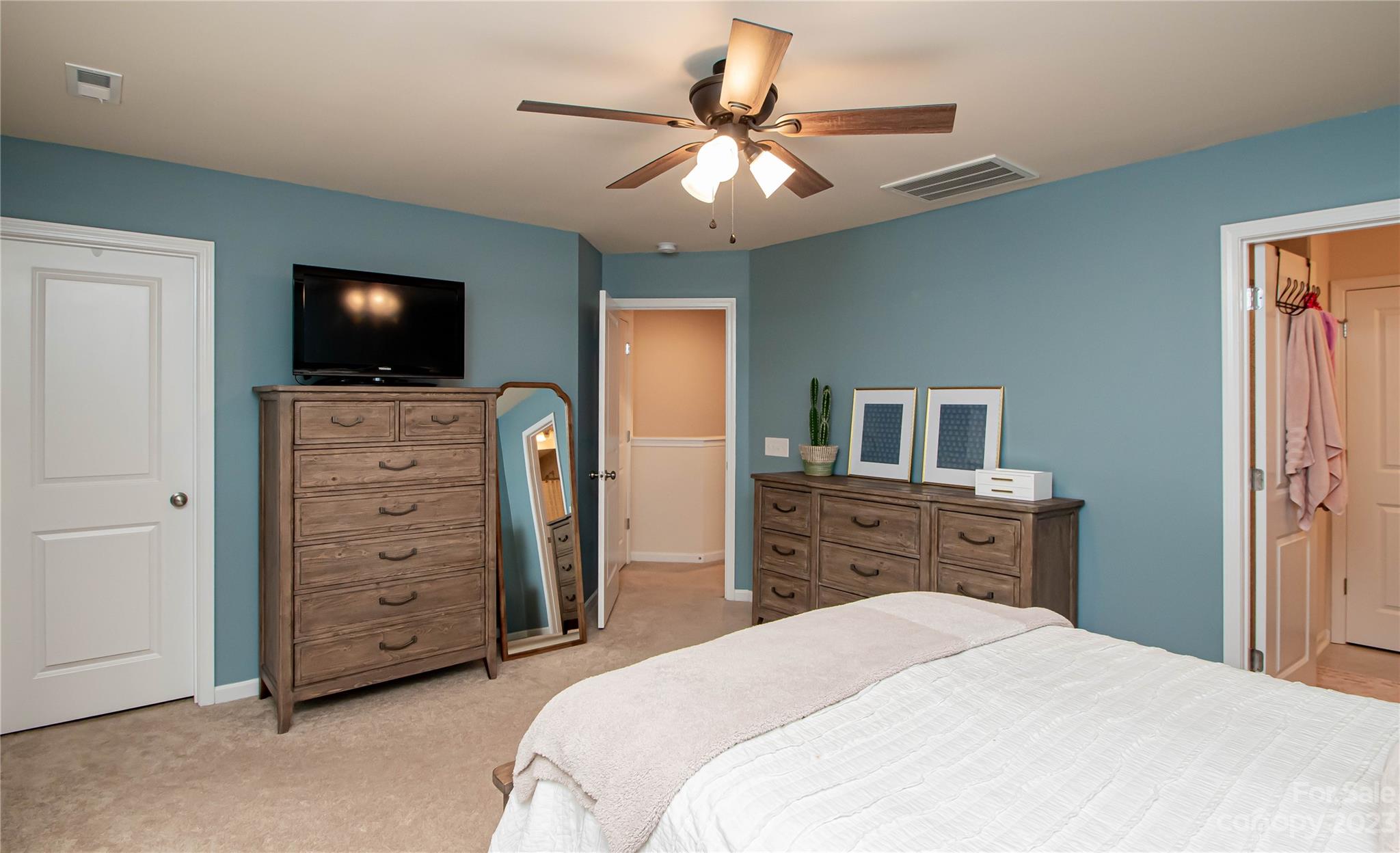 489 Hunters Dance Road Fort Mill, SC 29708 - Photo 23 of 36 a bedroom with a bed and a flat screen tv