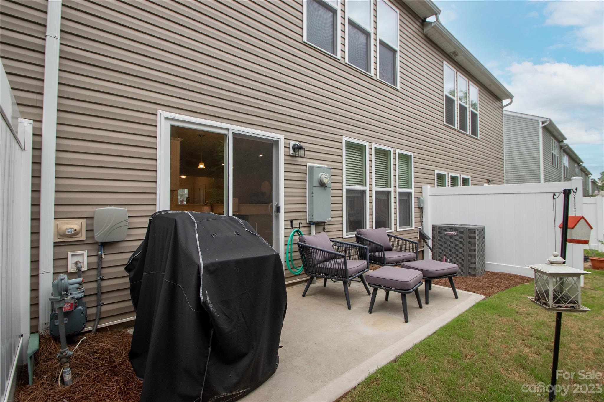 489 Hunters Dance Road Fort Mill, SC 29708 - Photo 26 of 36 a view of a patio with a table and chairs and couches