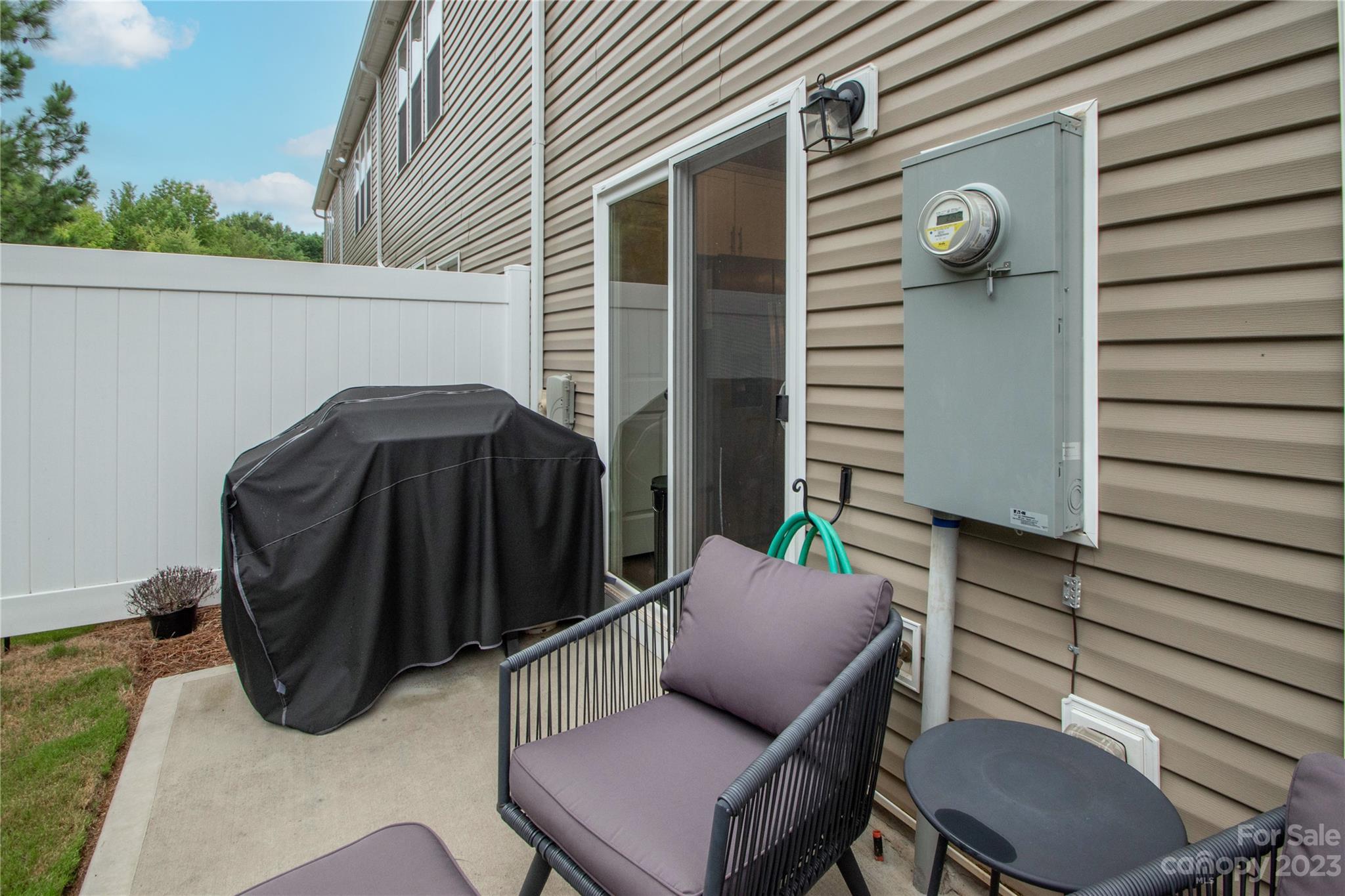 489 Hunters Dance Road Fort Mill, SC 29708 - Photo 27 of 36 a view of patio with a table and chairs and potted plants