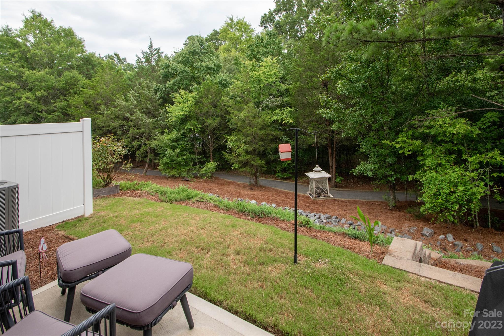 489 Hunters Dance Road Fort Mill, SC 29708 - Photo 28 of 36 a backyard of a house with table and chairs