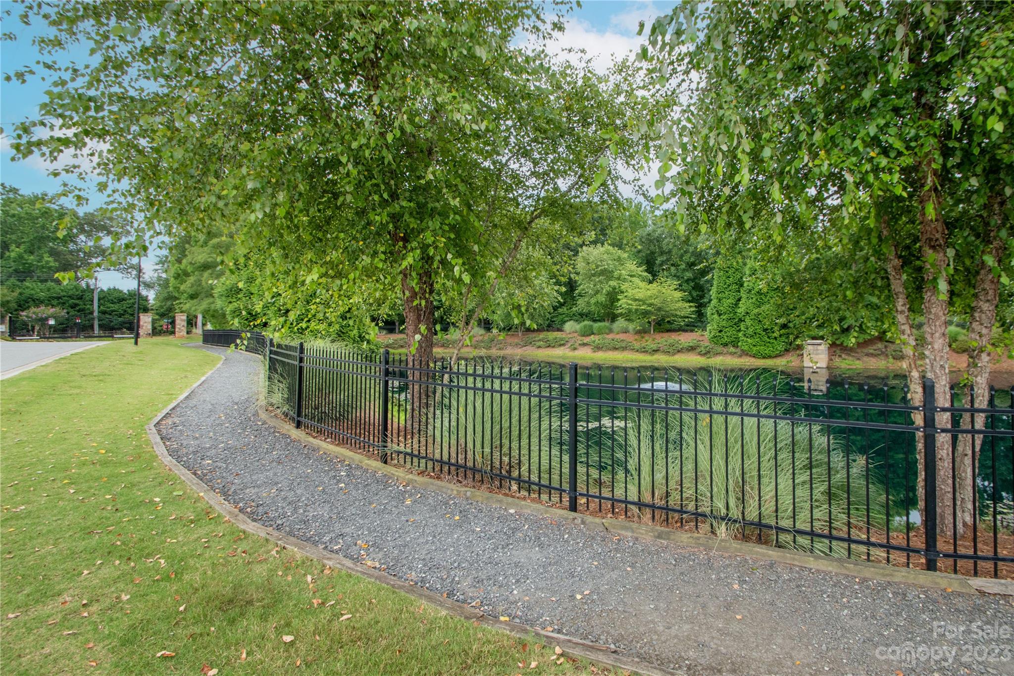 489 Hunters Dance Road Fort Mill, SC 29708 - Photo 32 of 36 a view of a backyard with a lake view