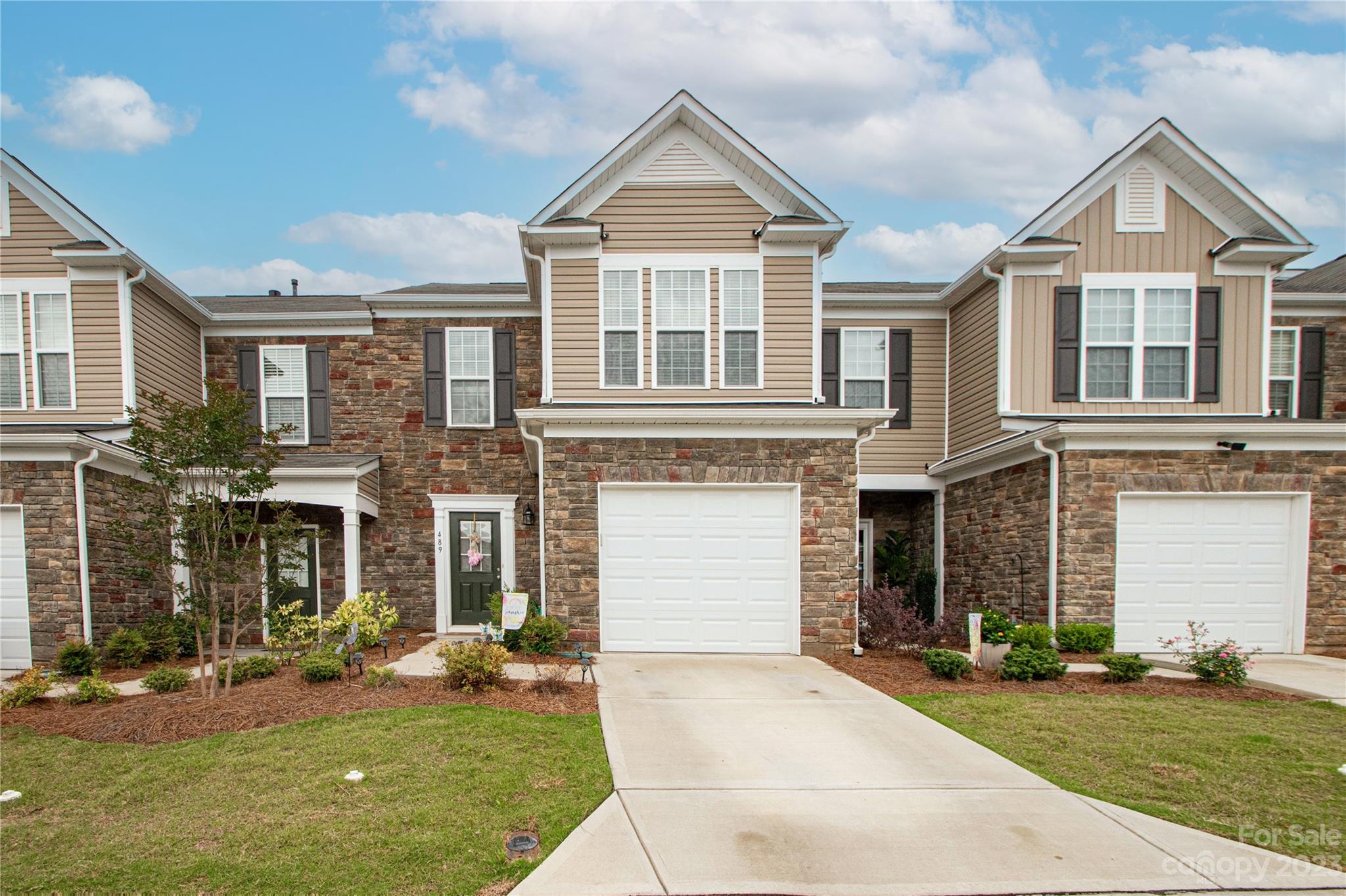 489 Hunters Dance Road Fort Mill, SC 29708 - Photo 36 of 36 a front view of a house with a yard and garage