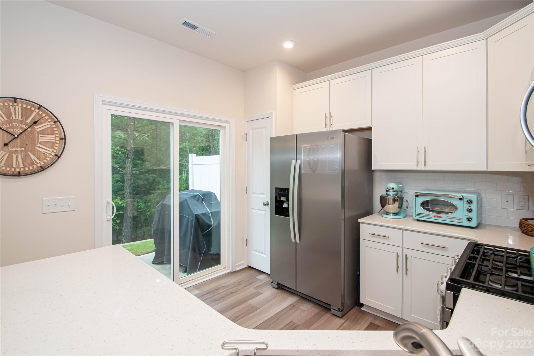 489 Hunters Dance Road Fort Mill, SC 29708 - Photo 9 of 36 a kitchen with stainless steel appliances a refrigerator sink and cabinets