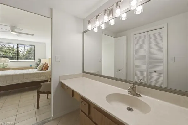 a bathroom with a sink double vanity and a mirror
