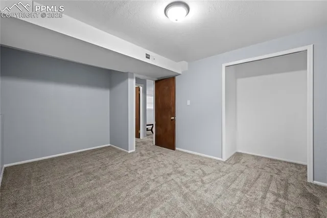a view of a patio with table and chairs and wooden floor
