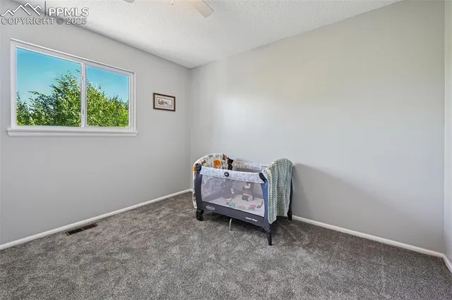 a bathroom with a granite countertop sink a toilet and bathtub