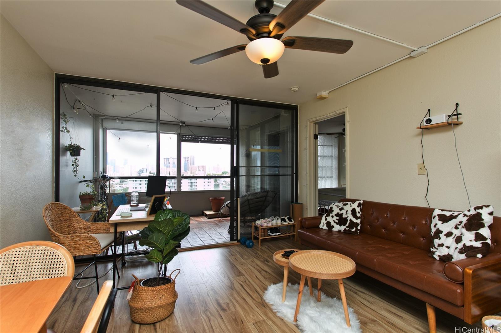 2100 Date Street, Unit 1002 Honolulu, HI 96826 - Photo 1 of 1 a living room with furniture and a large window