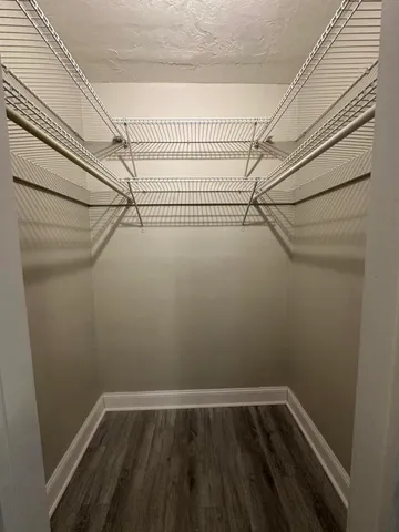 a view of a room with racks on the wall