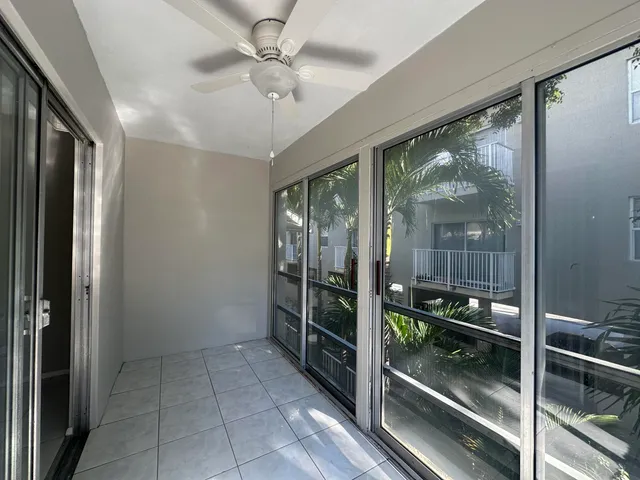 a view of a hallway with windows