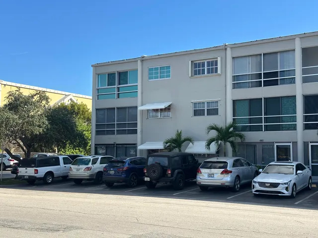 a view of a cars parked in front of a house